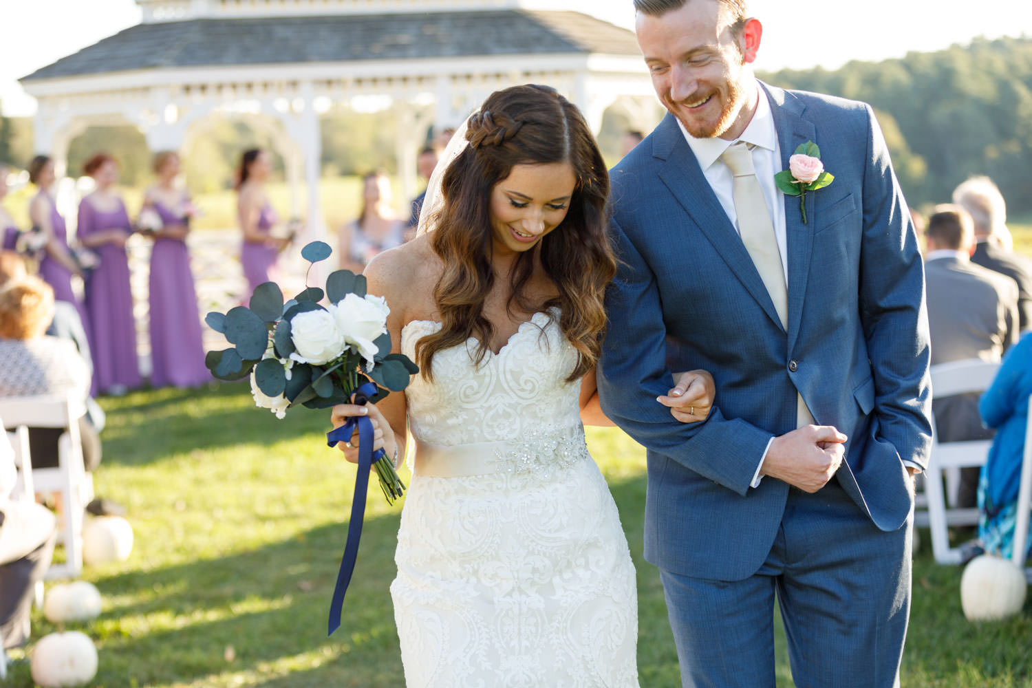 Bride and groom smiling during their recessional.