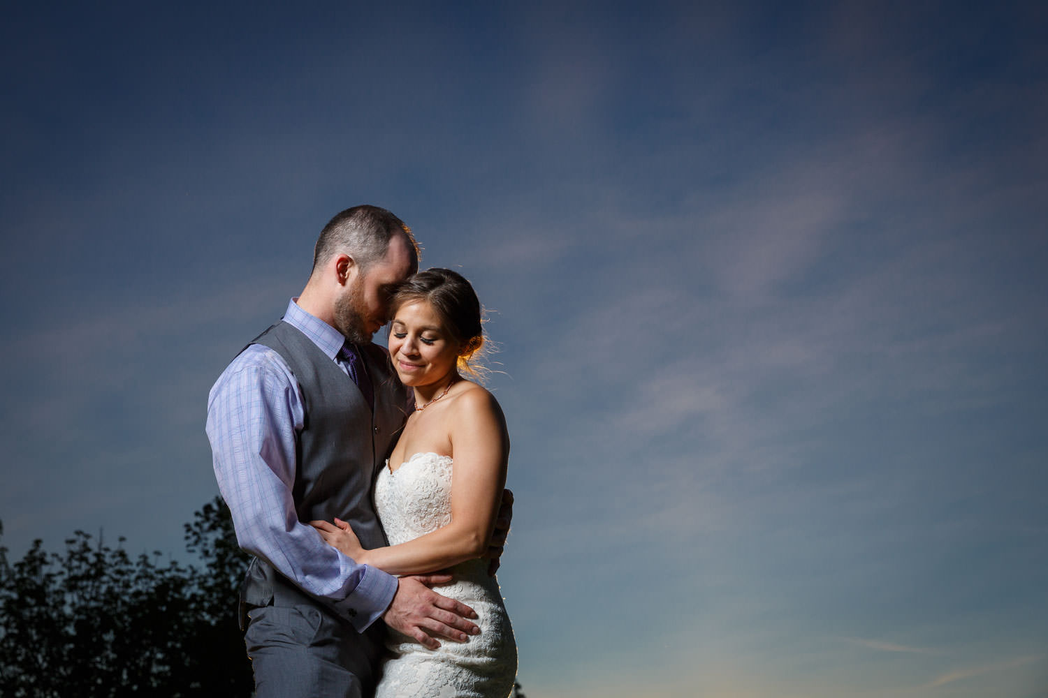 Bride and Groom portrait featuring bride at sunset