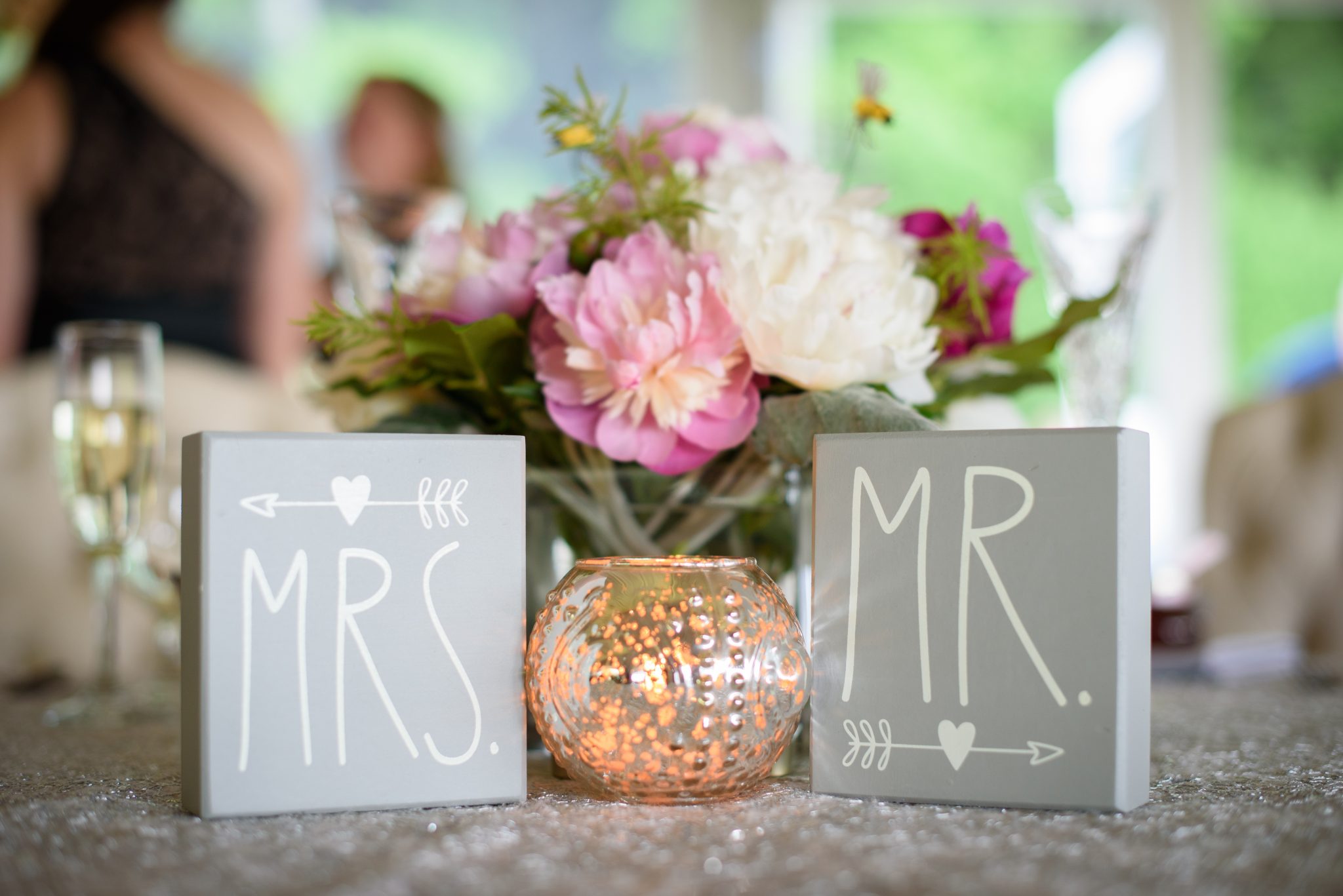 The Mountain Rose Inn weddings38 Mr and Mrs sign and wedding flowers
