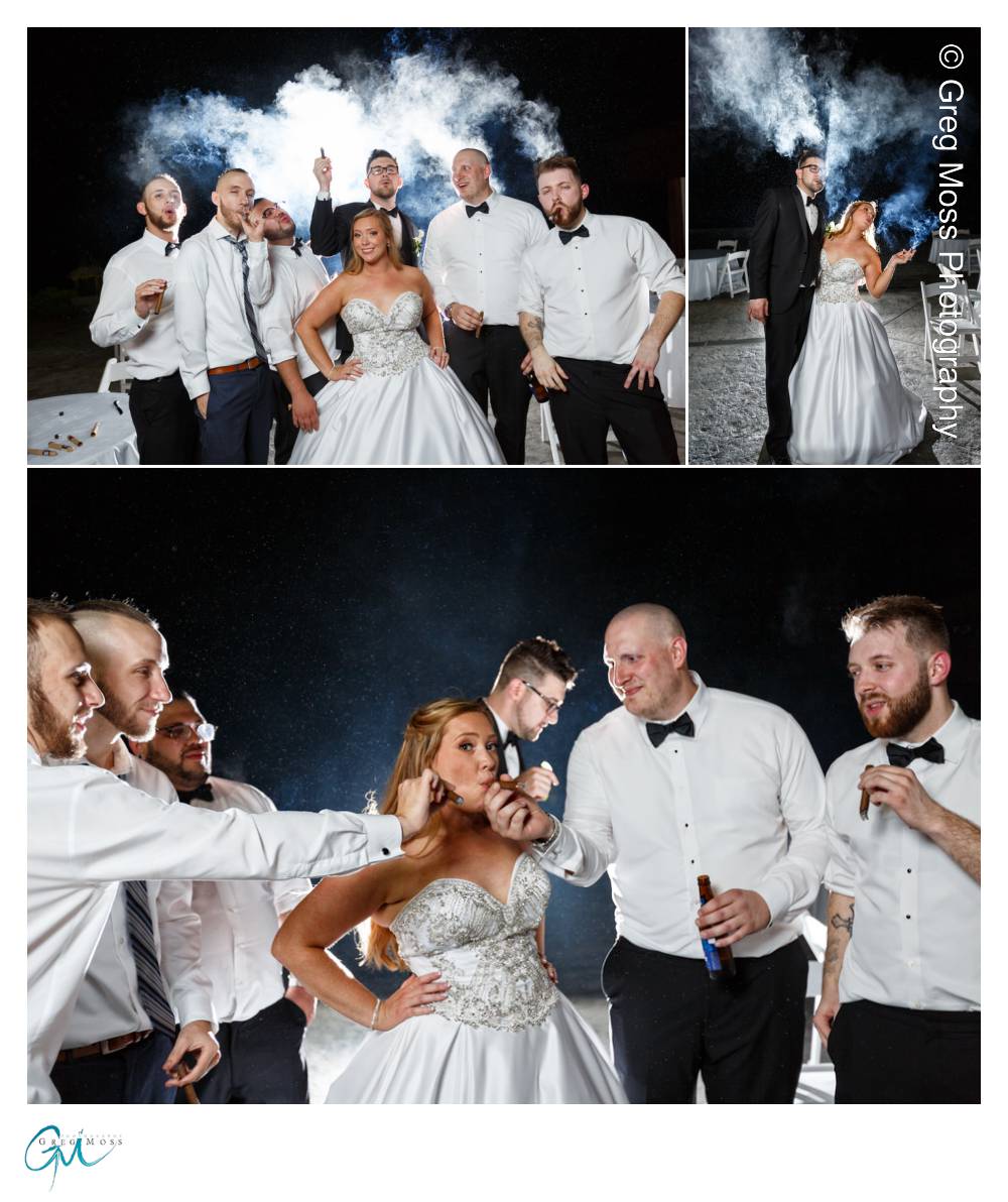 Bride and Groom and groomsmen smoking cigars at night outside.