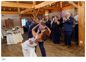 Groom dipping bride after introduction