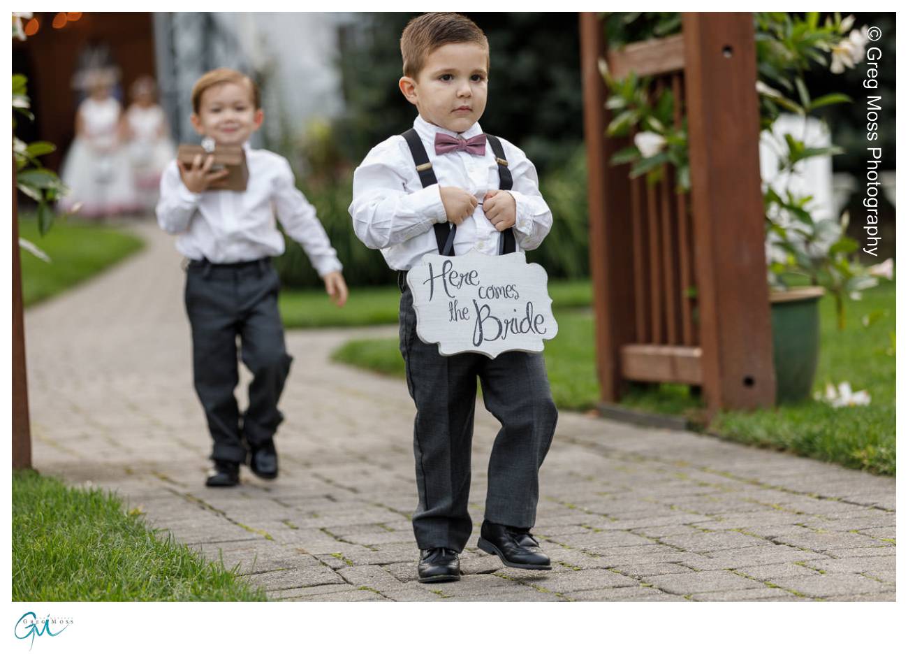 Ring bearer walking down the aisle