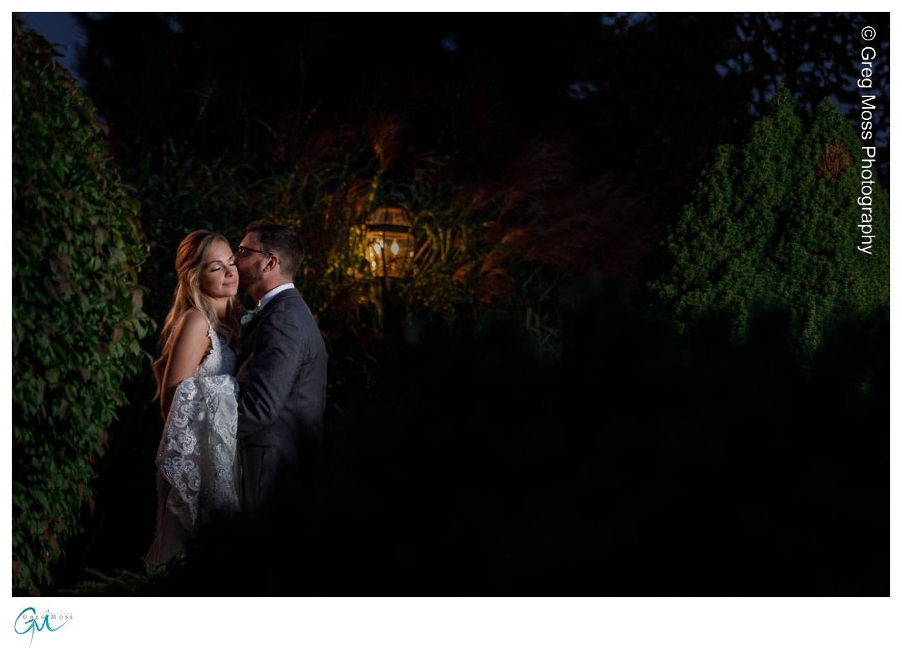 Bride and groom at night on path