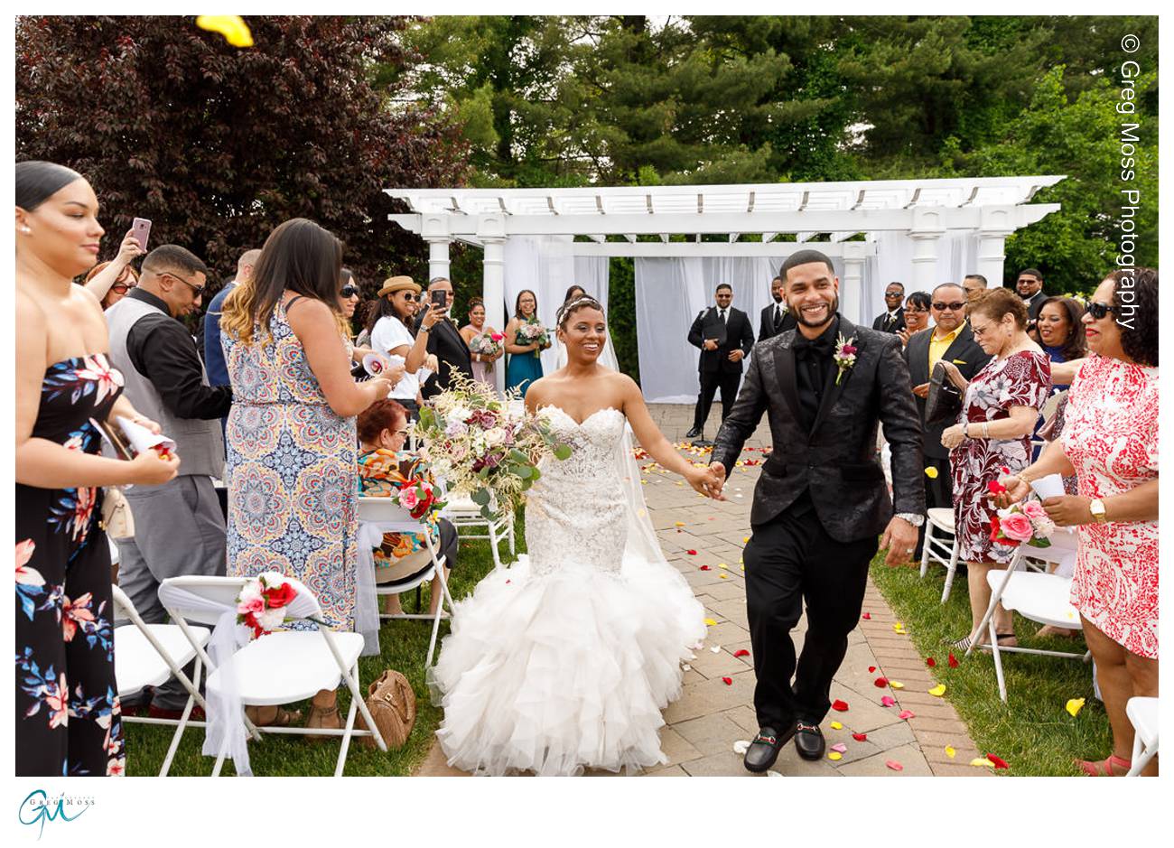 Bride and Groom walking down the aisle