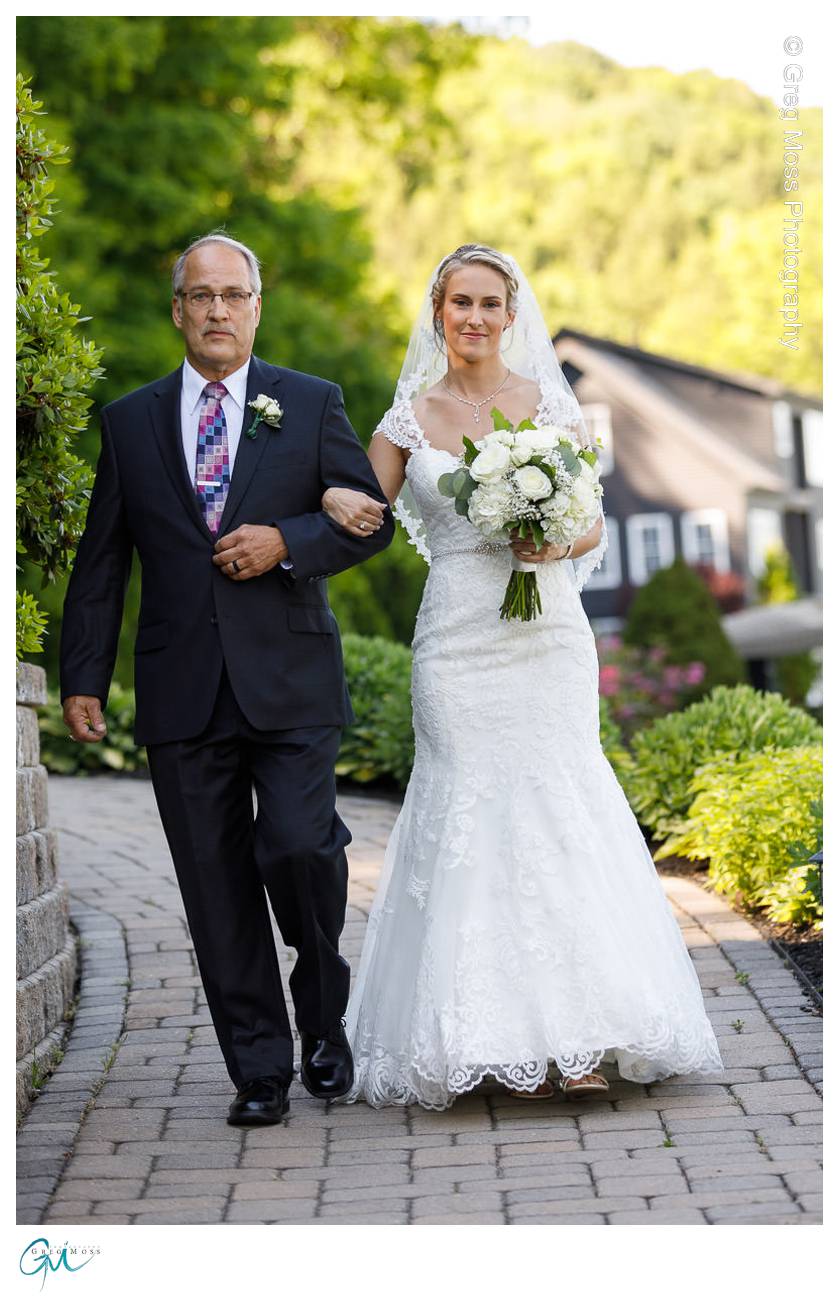 Father of the bride and Bride walking down the aisle