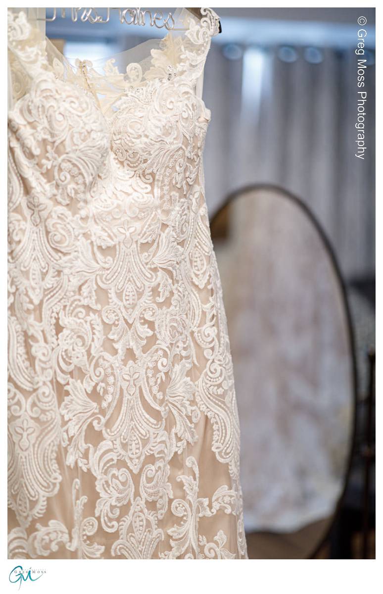 Red Barn Wedding 0523 Bride's dress with back of dress in mirror