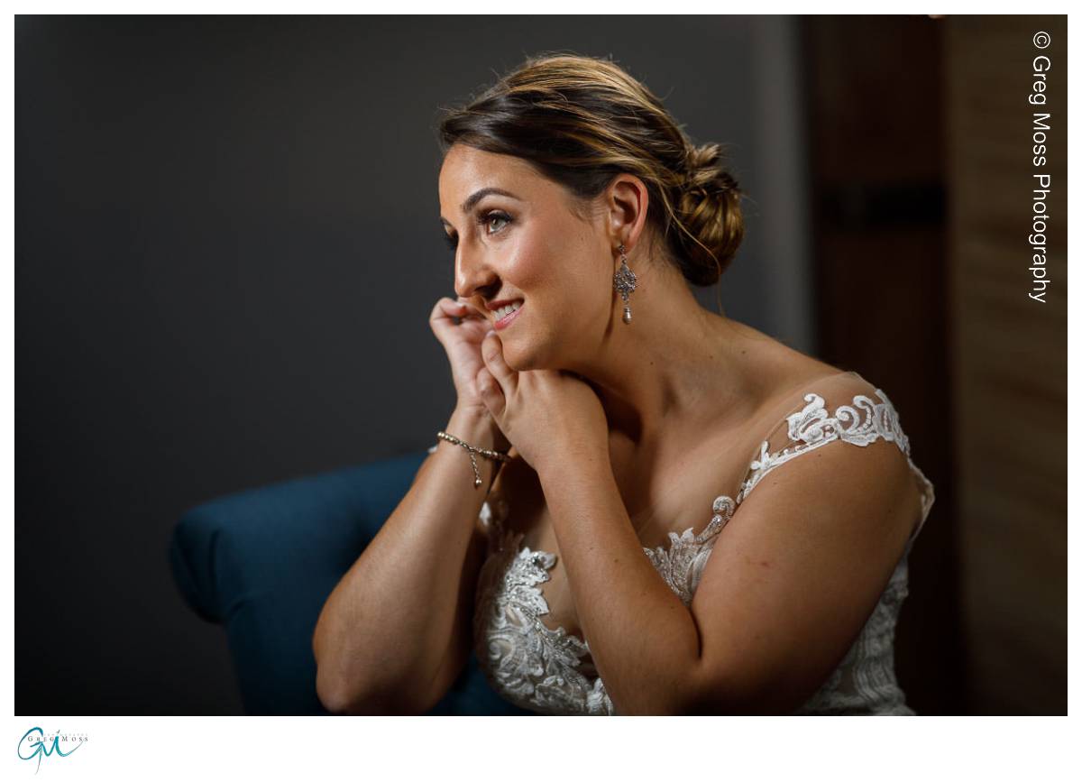 Red Barn Wedding0530 Bride putting on earrings