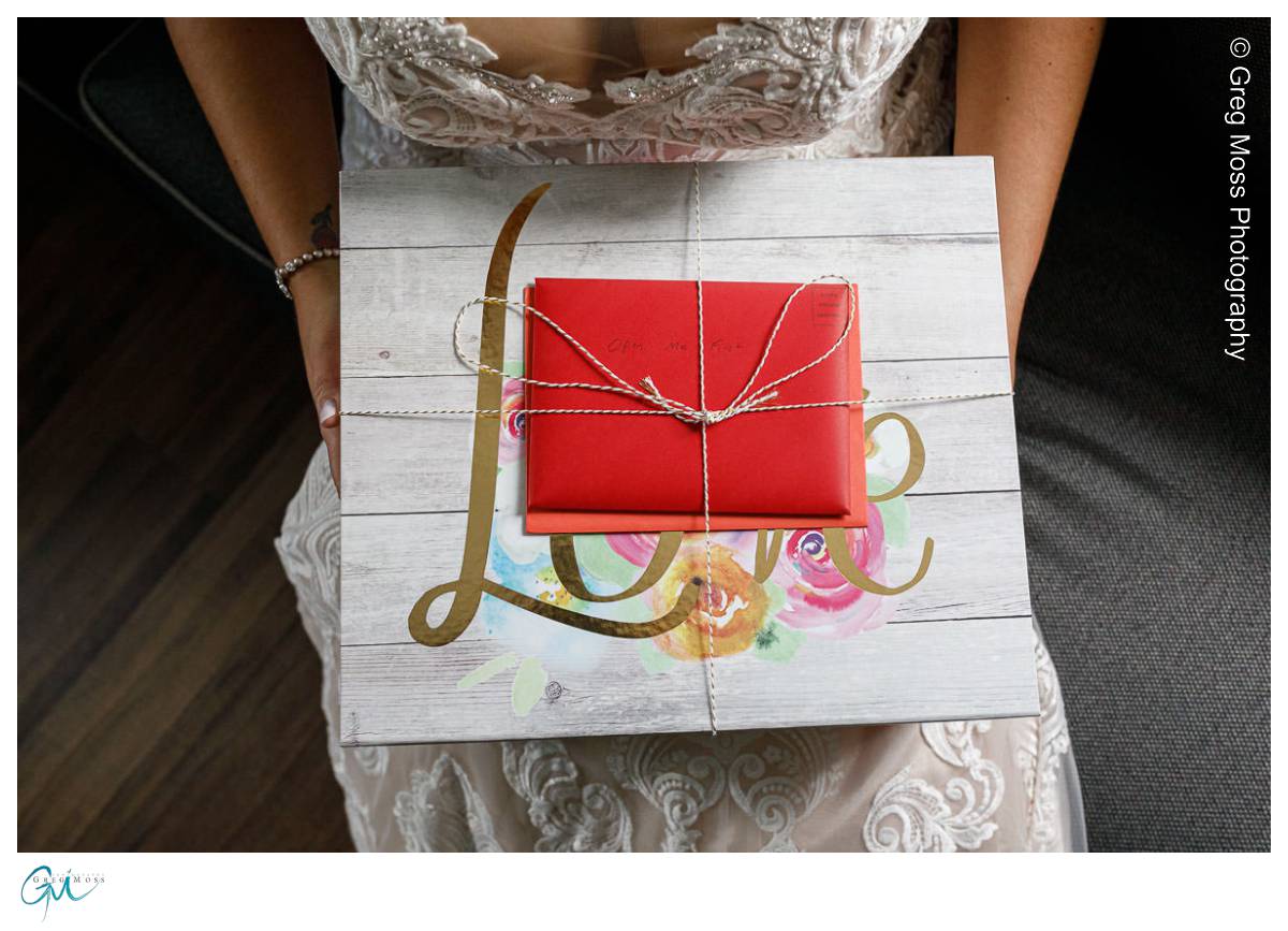 Red Barn Wedding0531 Bride opening gifts from groom