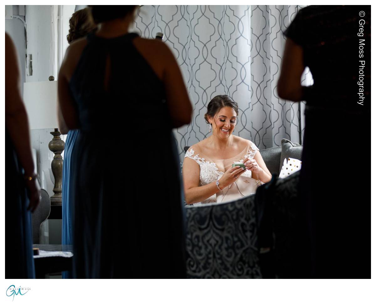 Red Barn Wedding0533 Bride opening gifts from groom
