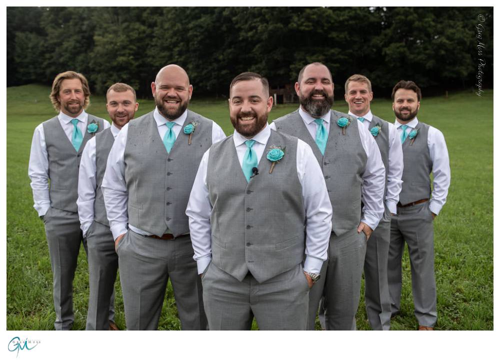Groom with groomsmen lined up in the flying V