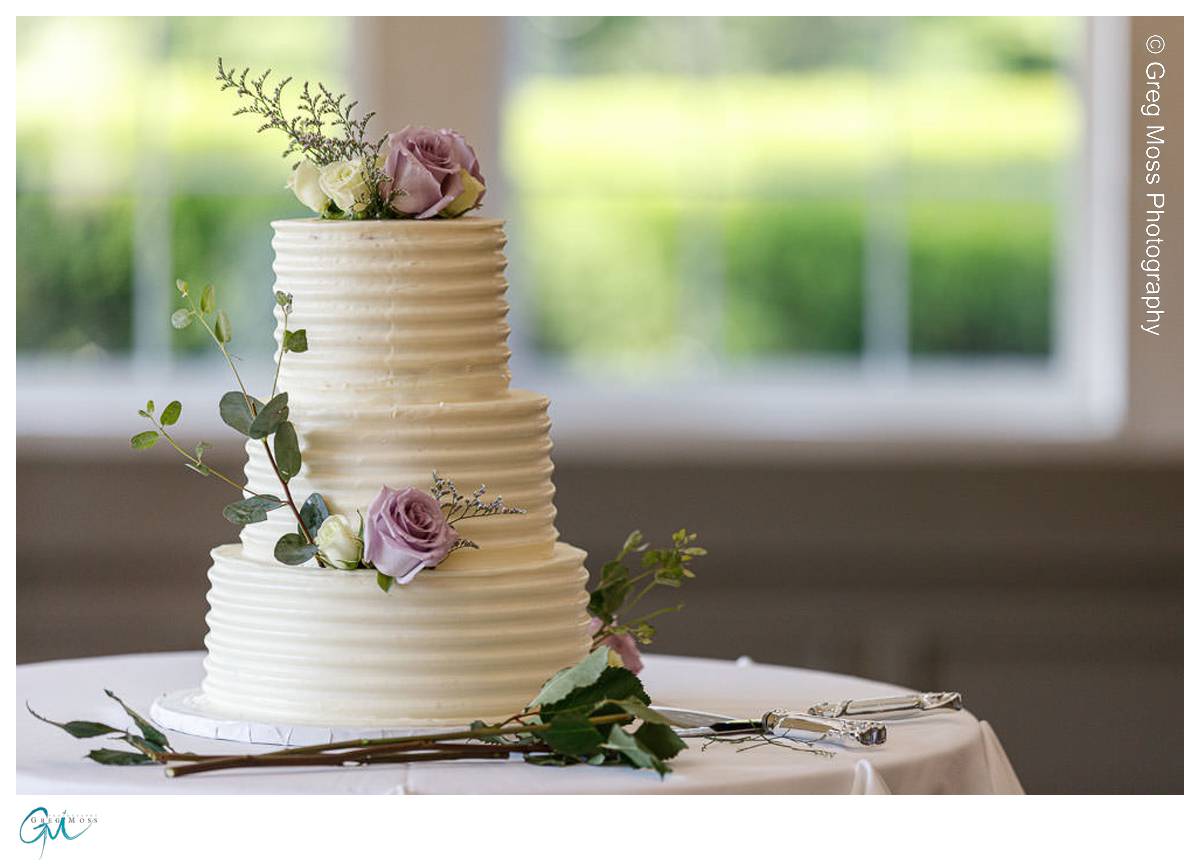 White wedding cake decorated with flowers
