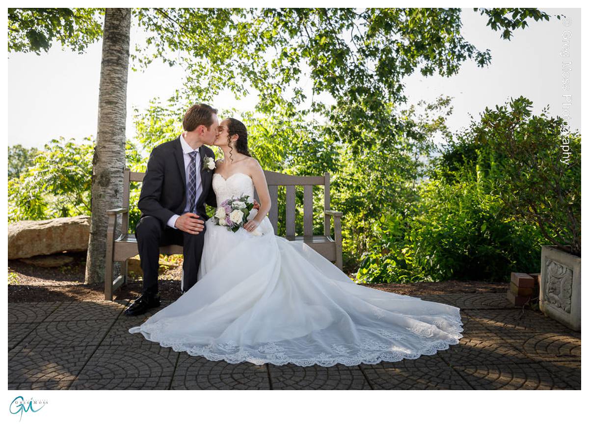 Bride and Groom on Bench in shade