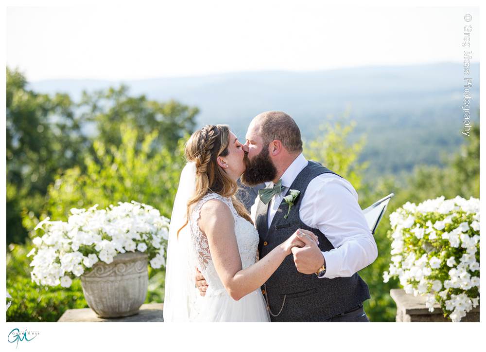 Log Cabin Wedding Photographer-12 Bride and Groom first kiss during ceremony