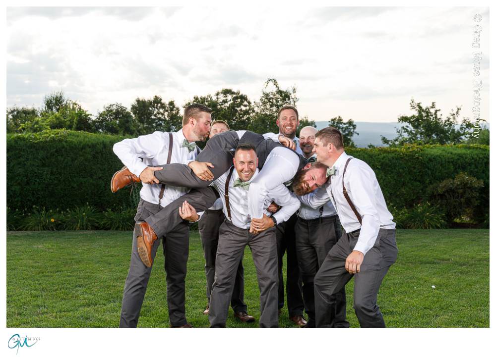 Log Cabin Wedding Photographer-14 Groomsmen in suspenders and bowties lifting groom up