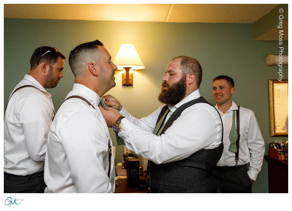 Log Cabin Wedding Photographer-2 Groom helping groomsmen with his tie
