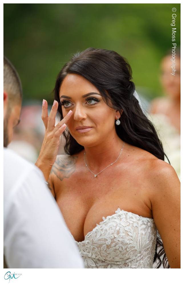 Mountain Rose Inn Wedding-14 Bride wiping tear during ceremony