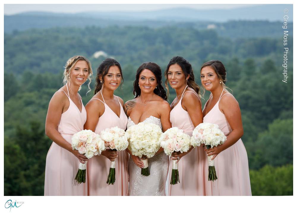 Mountain Rose Inn Wedding-20 Pretty bridesmaids in pink dresses with flowers.