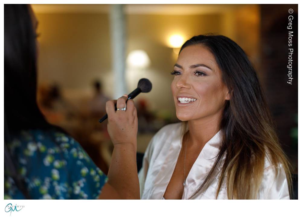 Mountain Rose Inn Wedding-4 Bridesmaid getting makeup applied while laughing