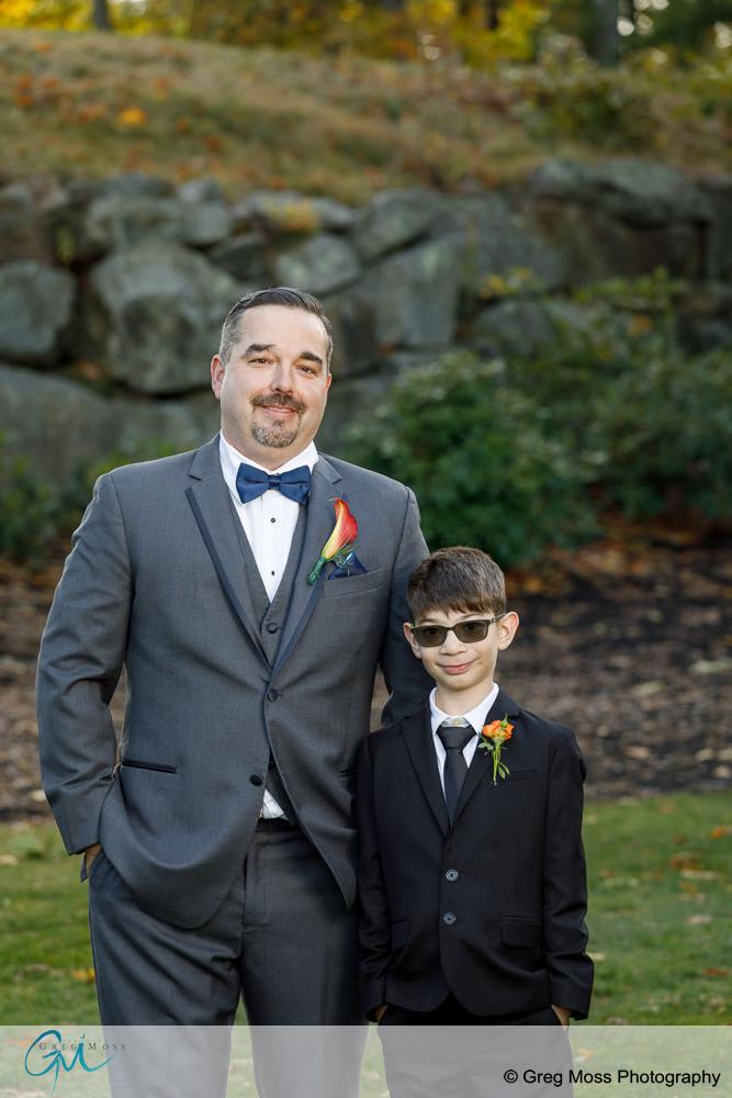 Portrait of Groom and his son on wedding day