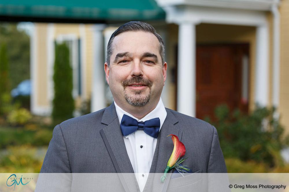 Groom waiting to see bride for first time right before wedding.