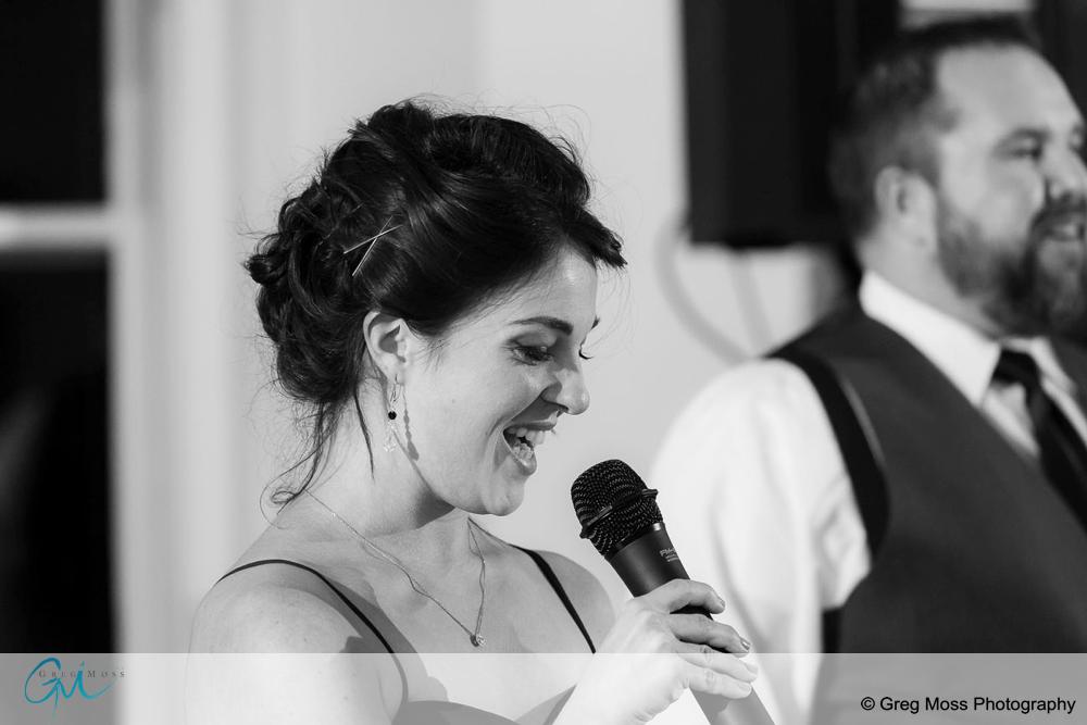 Black and white photo of Maid of honor giving speech