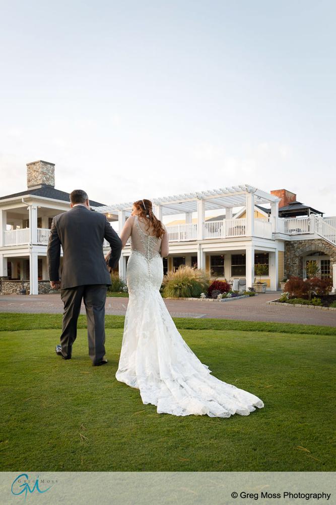 Bride and groom walking towards reception after wedding ceremony