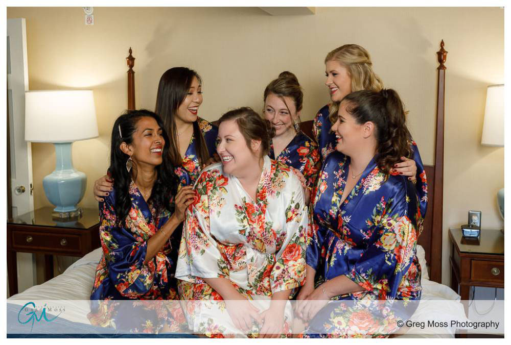 Bride and Bridesmaids wearing matching robes before wedding ceremony
