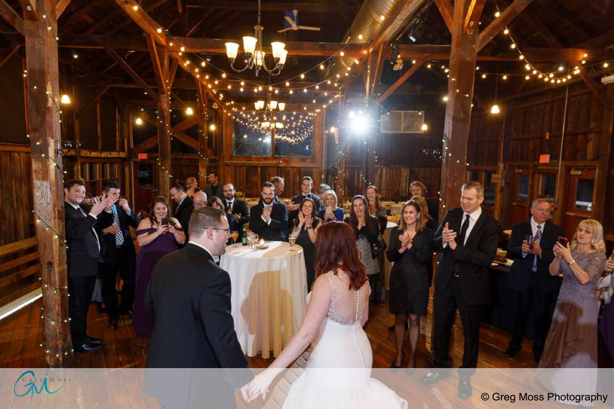 Bride and groom first dance with guests