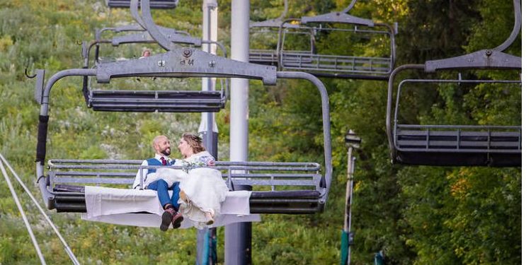 Jiminy Peak Wedding-12 Bride and groom riding up chair lift.