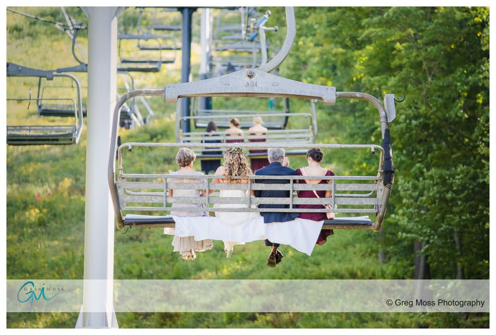 Jiminy Peak Wedding-7 Bride, mother, father and sister riding up chairlift at Jiminy peak