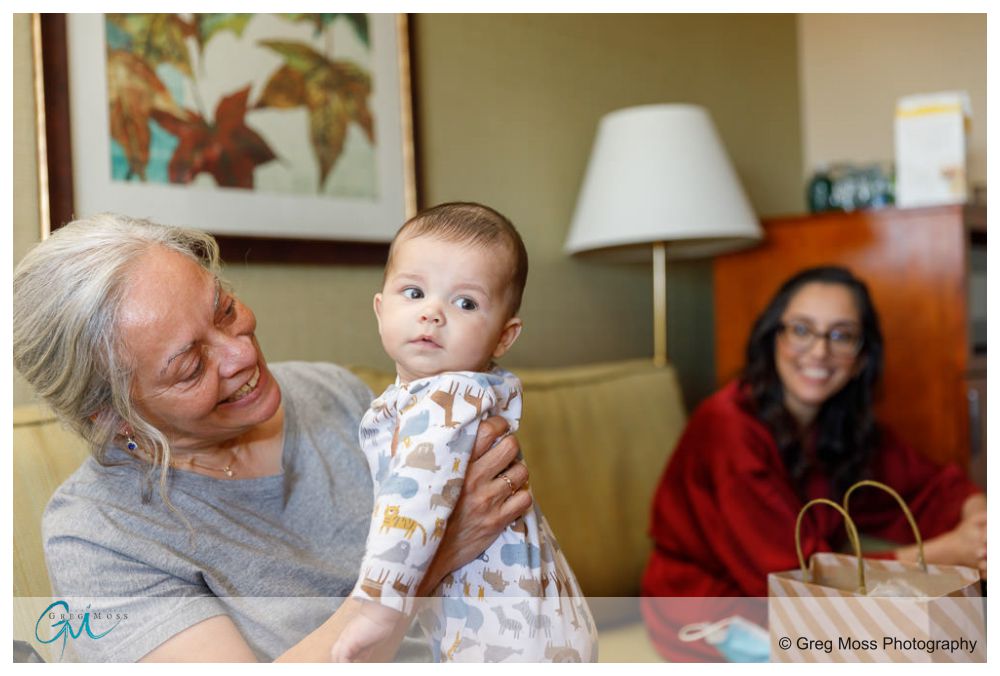 The Commons 1854-1 Grandmother holding baby at wedding.