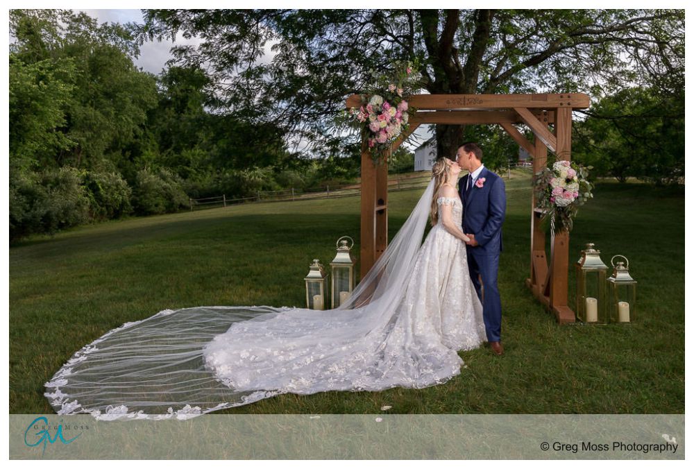 Publick House Wedding-15 Bride and groom kissing in front of alter made by the groom