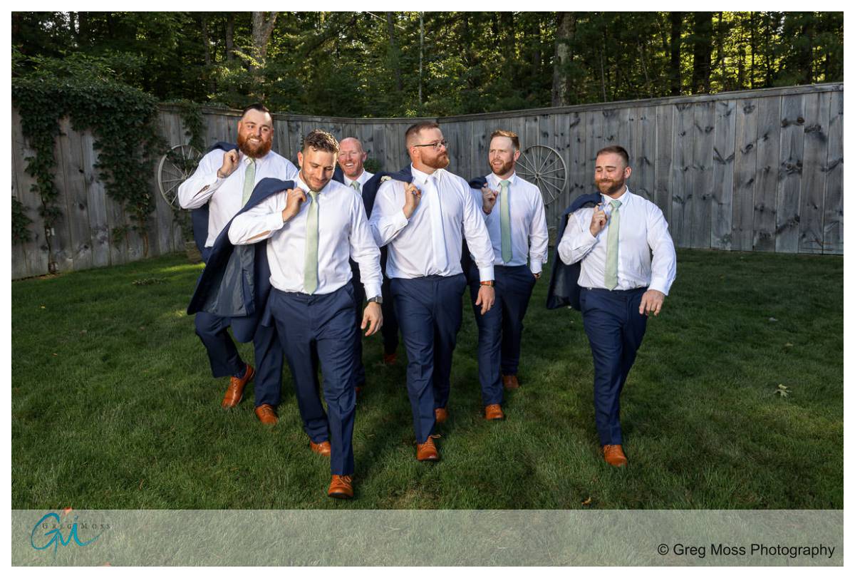 Blissful Meadows G. C. Wedding013 Walking photo of groom and groomsmen with jackets over their shoulders