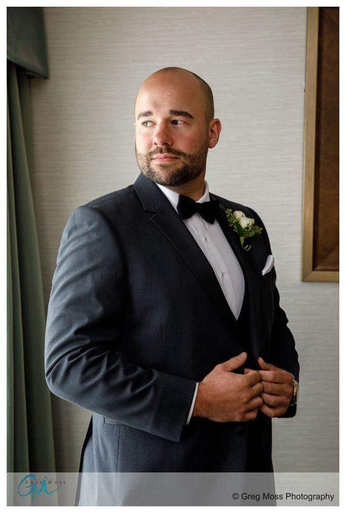 Log Cabin Holyoke Weddings-6 Groom window portrait at the D Hotel in Holyoke
