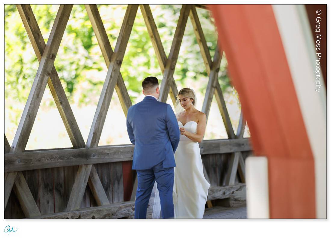 Stratton Mountain Wedding-7 Bride and Groom first look inside covered bridge at Stratton Mountain